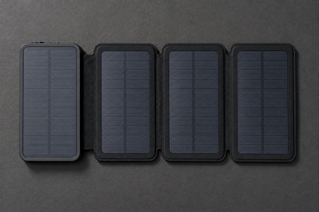 SPEC-F: open unit on a plain dark rubber mat, hard studio light