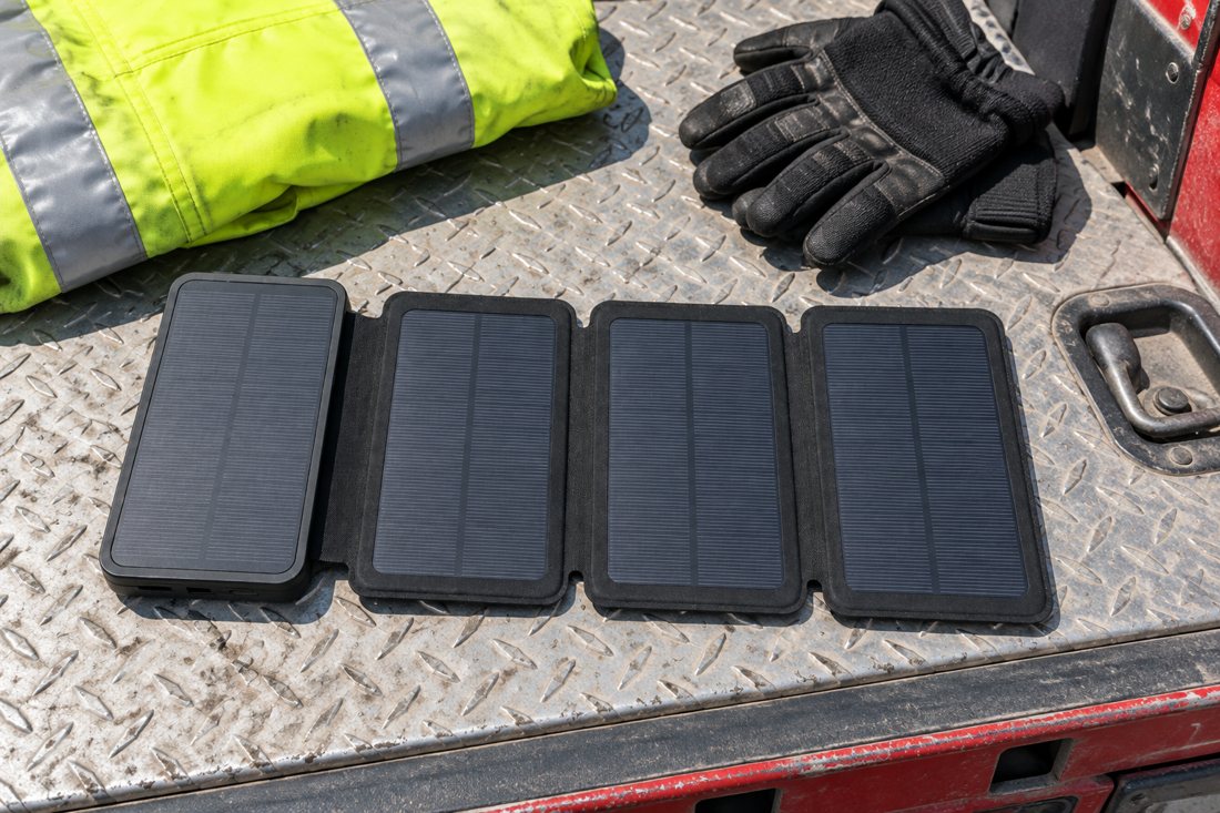 SPEC-H: open unit on a rescue truck's diamond-plate bed with a hi-vis jacket